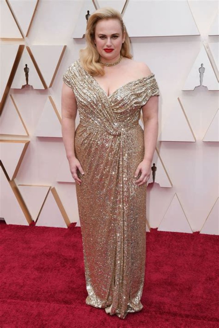 So Much Yes! Rebel Wilson Sparkles on 2020 Oscars Red Carpet in Gold Gown